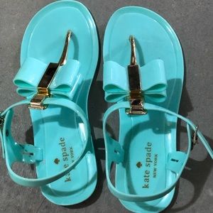 Kate Spade mint jelly sandals with gold accent.